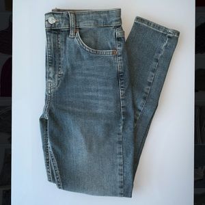 Topshop skinny jeans with a rip near the knee
